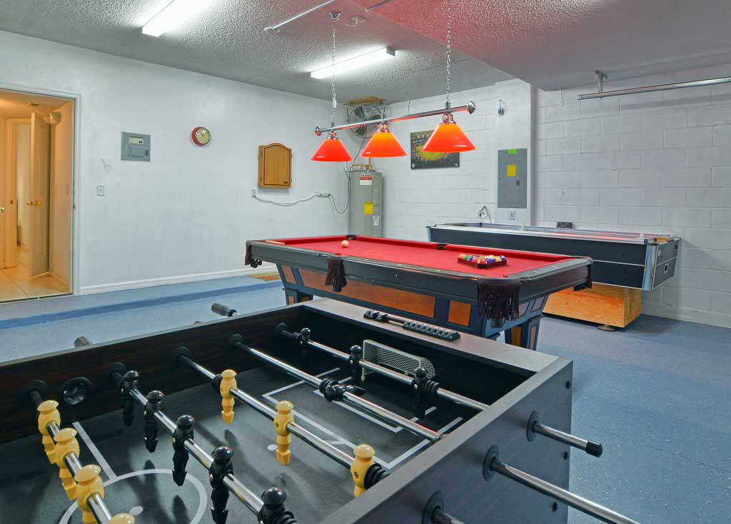 Games room with pool table, foosball table, air hockey table and an electronic dartboard
