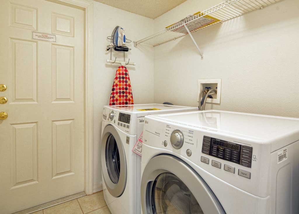 Utility room with washing machine and matching dryer